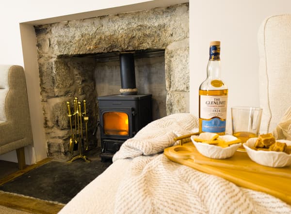 Lit wood burning fireplace