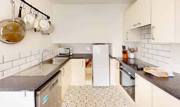 Galley kitchen with hanging pans