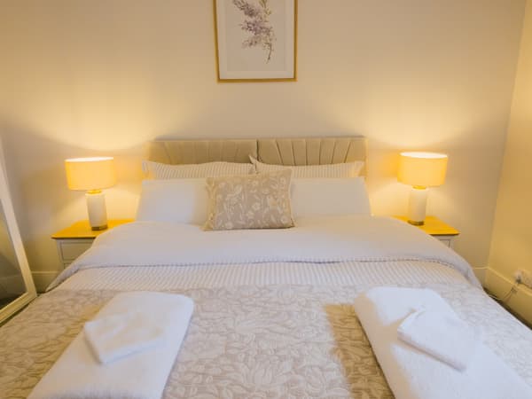 Bedroom two dressed with cream linen