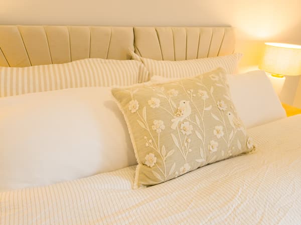 Embroidered floral cushion